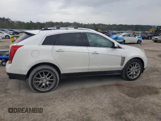 2013 Cadillac SRX Performance Collection z VIN 3GYFNHE33DS602428, wystawiony jako Copart lot #55688555 z przebiegiem 143 504 mil mil oraz Szkody całkowita. Historia ofert i sprzedaży dostępna na DreamBid. Obrazek 3.