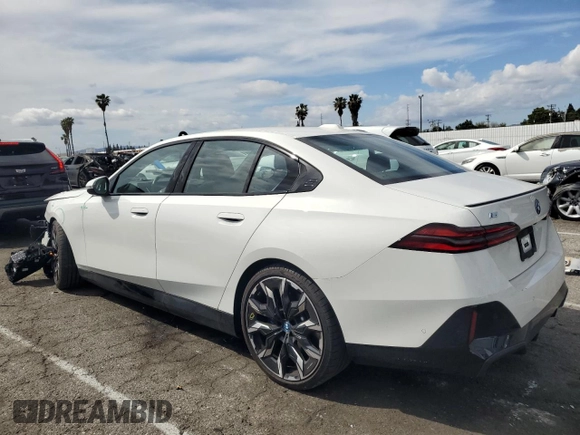 2024 BMW i5 eDrive40 with VIN WBY33FK04RCR92576, listed as a Copart auction lot 51180875 with 11,289 mi miles and Salvage title. Bid and sale history available at DreamBid. Image 2.