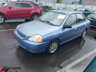 2003 Kia Rio with VIN KNADC125736227286, listed as a IAAI auction lot 41928174 with 151,431 mi miles. Bid and sale history available at carsss.com. Image 2.