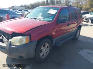 2003 Ford Escape XLT Popular with VIN 1FMYU03143KB33988, listed as a IAAI auction lot 41524123 with 1 mi miles. Bid and sale history available at carsss.com. Image 2.