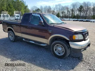 2000 Ford F-150 XL with VIN 1FTRX18L4YNA99427, listed as a Copart auction lot 49718795 with 0 mi miles and Salvage Title. Bid and sale history available at carsss.com. Image 4.