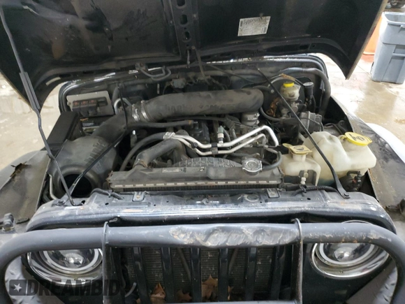 2006 Jeep Wrangler Sport z VIN 1J4FA49SX6P718734, wystawiony jako Copart lot #56516095 z przebiegiem 127 184 mil mil oraz Szkoda całkowita • Salvage title. Historia ofert i sprzedaży dostępna na DreamBid. Obrazek 11.