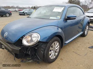 2019 Volkswagen Beetle S with VIN 3VWFD7AT8KM708865, listed as a IAAI auction lot 41692756 with 35,070 mi miles. Bid and sale history available at carsss.com. Image 2.