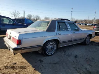 1991 Mercury Grand Marquis z VIN 2MECM74F4MX647208, wystawiony jako Copart lot #48439705 z przebiegiem 99 952 mil mil oraz Tytuł czysty. Historia ofert i sprzedaży dostępna na DreamBid. Obrazek 3.