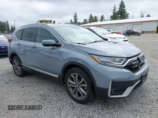 2021 Honda CR-V Touring with VIN 2HKRW2H94MH637809, listed as a IAAI auction lot 42489571 with 56,922 mi miles and . Bid and sale history available at DreamBid. Image 1.