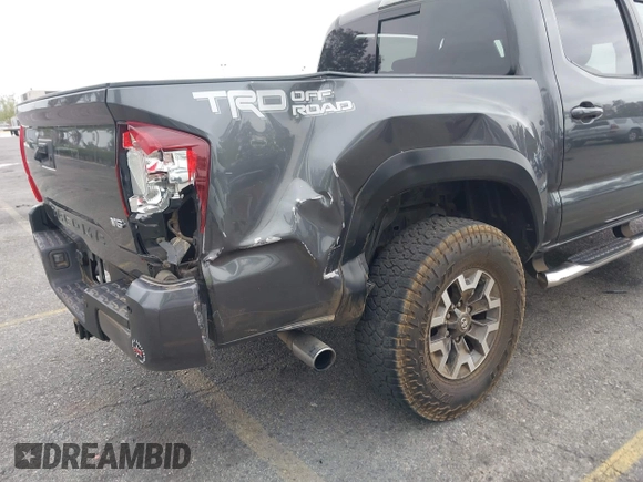 2018 Toyota Tacoma SR5 with VIN 3TMAZ5CN1JM071396, listed as a IAAI auction lot 42061640 with 122,148 mi miles and . Bid and sale history available at DreamBid. Image 6.