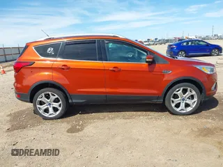 2019 Ford Escape Titanium with VIN 1FMCU9J92KUB28895, listed as a IAAI auction lot 42065235 with 112,305 mi miles and . Bid and sale history available at DreamBid. Image 13.