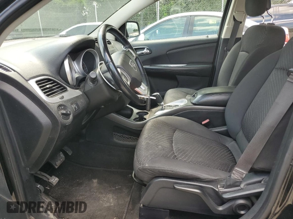 2015 Dodge Journey SXT with VIN 3C4PDCCG4FT697505, listed as a Copart auction lot 64888554 with 191,653 mi miles and Salvage title. Bid and sale history available at DreamBid. Image 7.