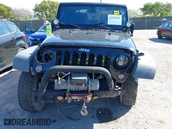 2016 Jeep Wrangler Willys Wheeler z VIN 1C4AJWAG9GL257621, wystawiony jako IAAI lot #41432306 z przebiegiem 84 248 mil mil oraz . Historia ofert i sprzedaży dostępna na DreamBid. Obrazek 6.