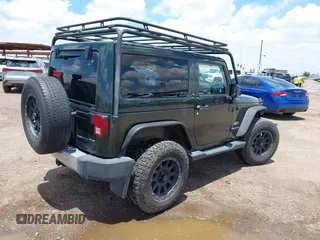 2012 Jeep Wrangler Sahara z VIN 1C4AJWBGXCL100527, wystawiony jako IAAI lot #42394623 z przebiegiem 126 097 mil mil oraz . Historia ofert i sprzedaży dostępna na DreamBid. Obrazek 4.