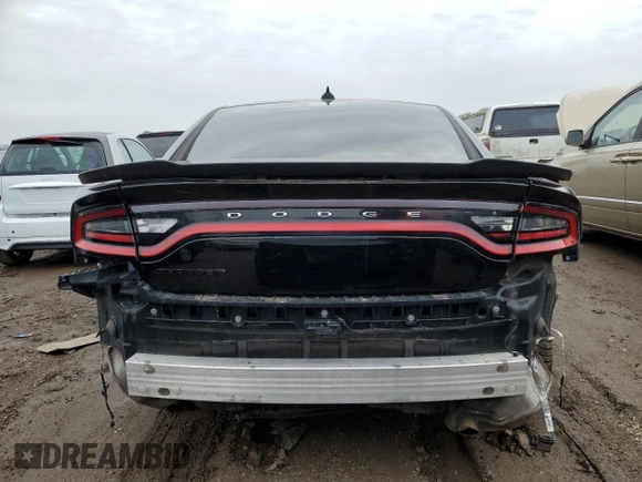 2017 Dodge Charger SXT with VIN 2C3CDXHG6HH606426, listed as a Copart auction lot 52100185 with 122,910 mi miles and Salvage Title. Bid and sale history available at DreamBid. Image 6.
