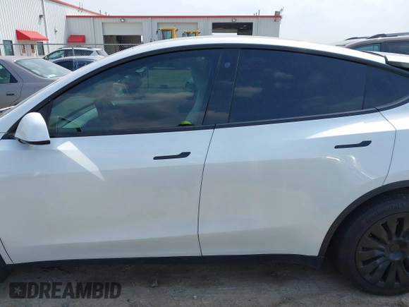 2023 Tesla Model Y Long Range with VIN 7SAYGAEEXPF776370, listed as a IAAI auction lot 42127512 with 27,120 mi miles and . Bid and sale history available at DreamBid. Image 15.