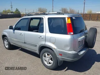 1999 Honda CR-V EX with VIN JHLRD1860XC056641, listed as a IAAI auction lot 42018329 with 321,707 mi miles. Bid and sale history available at carsss.com. Image 3.