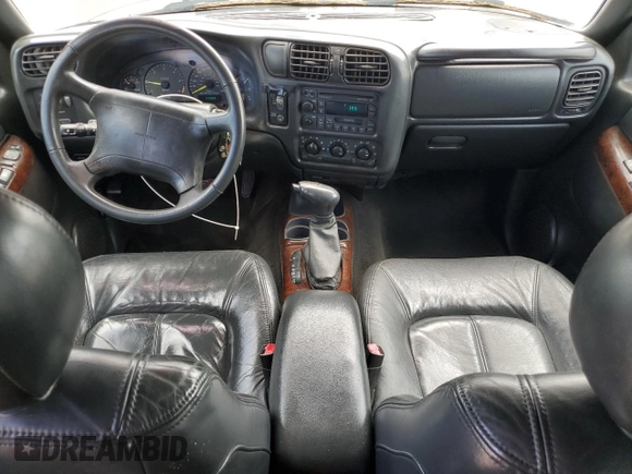 1998 Oldsmobile Bravada z VIN 1GHDT13W9W2718457, wystawiony jako Copart lot #55341755 z przebiegiem 133 968 mil mil oraz Tytuł czysty. Historia ofert i sprzedaży dostępna na DreamBid. Obrazek 8.