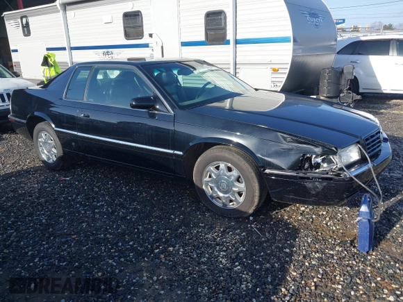 1999 Cadillac Eldorado Touring z VIN 1G6ET129XXU603042, wystawiony jako IAAI lot #41699955 z przebiegiem 81 704 mil mil oraz . Historia ofert i sprzedaży dostępna na DreamBid. Obrazek 1.