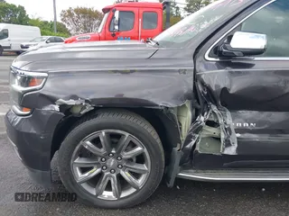 2015 Chevrolet Suburban LTZ with VIN 1GNSKKKC4FR589913, listed as a IAAI auction lot 42017190 with 216,145 mi miles. Bid and sale history available at carsss.com. Image 6.