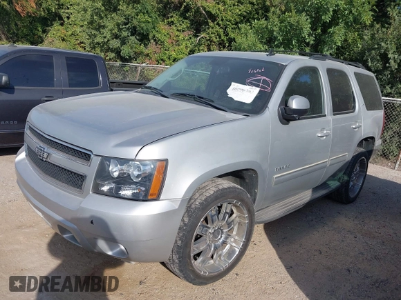 2011 Chevrolet Tahoe LS with VIN 1GNSCAE00BR140716, listed as a IAAI auction lot 40225018 with 189,052 mi miles and . Bid and sale history available at DreamBid. Image 2.