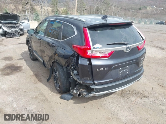 2019 Honda CR-V Touring with VIN 2HKRW2H9XKH636354, listed as a IAAI auction lot 41902615 with 66,781 mi miles and . Bid and sale history available at DreamBid. Image 3.