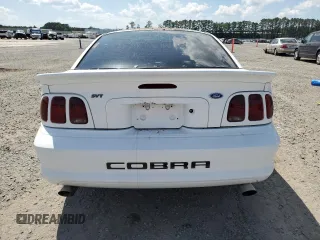 1996 Ford Mustang Cobra с VIN 1FALP47V4TF118643, выставлен на аукционе Copart как лот 57999885 с пробегом Не указан миль и Списание • Salvage title. История ставок и продаж доступна на DreamBid. Изображение 6.