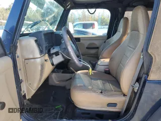 2000 Jeep Wrangler Sport with VIN 1J4FA49S7YP802304, listed as a Copart auction lot 47854795 with 0 mi miles and Salvage Title. Bid and sale history available at carsss.com. Image 7.