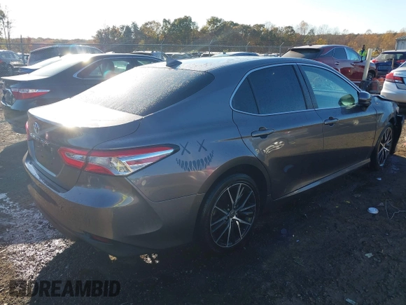 2020 Toyota Camry LE with VIN 4T1C11AKXLU884764, listed as a IAAI auction lot 40821088 with 111,631 mi miles. Bid and sale history available at carsss.com. Image 4.