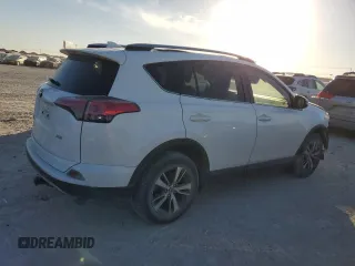 2018 Toyota RAV4 XLE with VIN JTMWFREV7JJ742974, listed as a Copart auction lot 41957735 with 87,005 mi miles and Salvage Title. Bid and sale history available at DreamBid. Image 3.