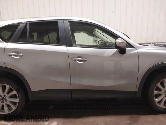 2015 Mazda CX-5 Grand Touring with VIN JM3KE4DY2F0477966, listed as a IAAI auction lot 41247178 with 116,582 mi miles. Bid and sale history available at carsss.com. Image 14.