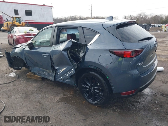 2021 Mazda CX-5 Touring z VIN JM3KFBCM5M0332644, wystawiony jako IAAI lot #41083205 z przebiegiem 36 105 mil mil oraz . Historia ofert i sprzedaży dostępna na DreamBid. Obrazek 3.