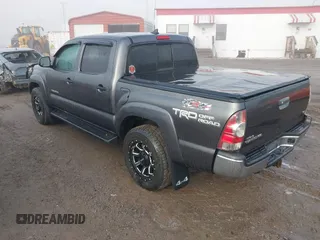 2015 Toyota Tacoma with VIN 3TMLU4EN7FM201302, listed as a IAAI auction lot 41666606 with 200,504 mi miles and . Bid and sale history available at DreamBid. Image 3.