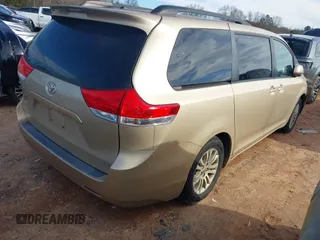 2011 Toyota Sienna XLE AAS with VIN 5TDYK3DCXBS117023, listed as a IAAI auction lot 41581785 with 216,341 mi miles. Bid and sale history available at carsss.com. Image 4.