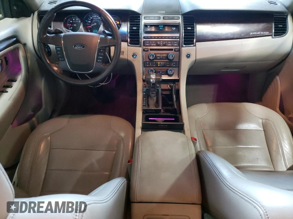 2012 Ford Taurus Limited with VIN 1FAHP2JW3CG142762, listed as a Copart auction lot 77864584 with 131,911 mi miles and Salvage title. Bid and sale history available at DreamBid. Image 8.