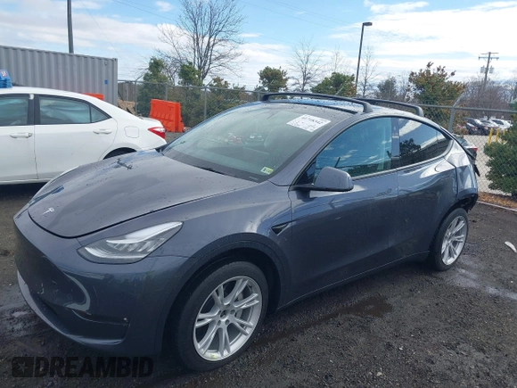 2023 Tesla Model Y Long Range with VIN 7SAYGDEE8PF599254, listed as a IAAI auction lot 41718342 with 24,339 mi miles and . Bid and sale history available at carsss.com. Image 20.