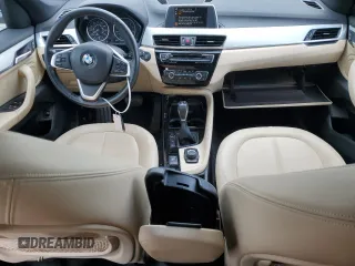 2016 BMW X1 xDrive28i z VIN WBXHT3C37GP882189, wystawiony jako Copart lot #56983985 z przebiegiem 45 700 mil mil oraz Szkoda całkowita • Salvage title. Historia ofert i sprzedaży dostępna na DreamBid. Obrazek 8.