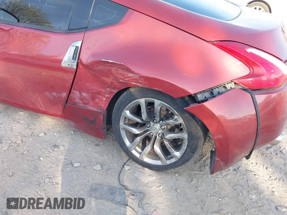 2014 Nissan 370Z Nismo with VIN JN1AZ4EH9EM636340, listed as a IAAI auction lot 42112548 with 143,894 mi miles and . Bid and sale history available at DreamBid. Image 6.