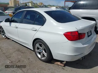 2015 BMW 3 Series 328i with VIN WBA3A5G51FNS89956, listed as a IAAI auction lot 42012575 with 121,246 mi miles. Bid and sale history available at carsss.com. Image 3.