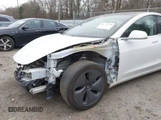 2020 Tesla Model 3 Standard Range Plus with VIN 5YJ3E1EA1LF799766, listed as a IAAI auction lot 41386508 with 90,000 mi miles. Bid and sale history available at carsss.com. Image 20.