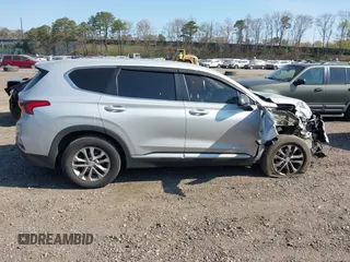 2019 Hyundai Santa Fe SE with VIN 5NMS23AD3KH102739, listed as a IAAI auction lot 42097252 with 116,023 mi miles and . Bid and sale history available at DreamBid. Image 13.
