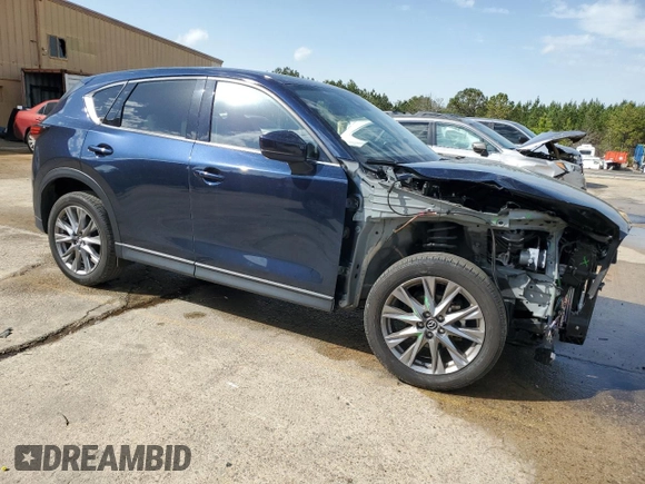 2021 Mazda CX-5 Grand Touring with VIN JM3KFBDM8M0489180, listed as a Copart auction lot 49900525 with 34,687 mi miles and Salvage Title. Bid and sale history available at carsss.com. Image 4.