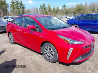 2021 Toyota Prius LE z VIN JTDL9MFU1M3028284, wystawiony jako IAAI lot #42027191 z przebiegiem 62 471 mil mil oraz . Historia ofert i sprzedaży dostępna na DreamBid. Obrazek 1.