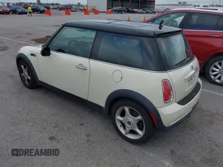 2006 MINI Hardtop with VIN WMWRC33566TK73763, listed as a IAAI auction lot 42782654 with 103,751 mi miles and . Bid and sale history available at DreamBid. Image 3.
