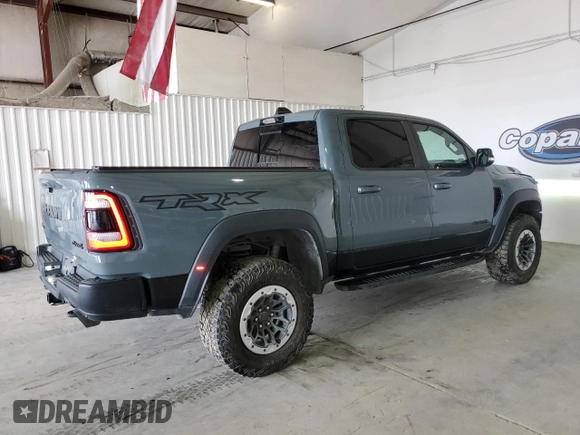 2021 Ram 1500 with VIN 0K1905786880, listed as a Copart auction lot 61756114 with 34,927 mi miles and Clean title. Bid and sale history available at DreamBid. Image 3.