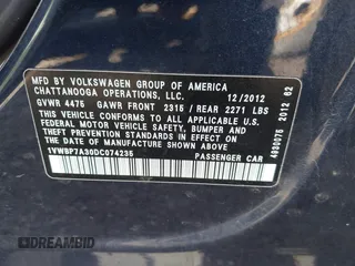 2013 Volkswagen Passat SE w/Sunroof & Nav with VIN 1VWBP7A30DC074235, listed as a IAAI auction lot 41967875 with 153,803 mi miles. Bid and sale history available at carsss.com. Image 9.