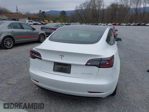 2021 Tesla Model 3 Long Range with VIN 5YJ3E1EBXMF980102, listed as a IAAI auction lot 41944364 with 48,766 mi miles and . Bid and sale history available at carsss.com. Image 16.