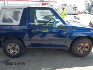 1997 Chevrolet Tracker z VIN 2CNBE1865V6926154, wystawiony jako IAAI lot #42207157 z przebiegiem 176 104 mil mil oraz . Historia ofert i sprzedaży dostępna na DreamBid. Obrazek 13.