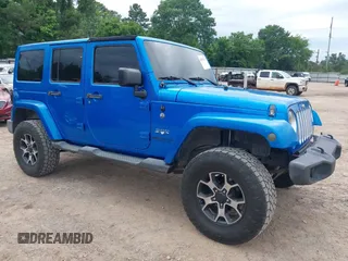 2016 Jeep Wrangler Unlimited 75th Anniversary with VIN 1C4HJWEG0GL154418, listed as a IAAI auction lot 42192717 with 102,514 mi miles and . Bid and sale history available at DreamBid. Image 1.