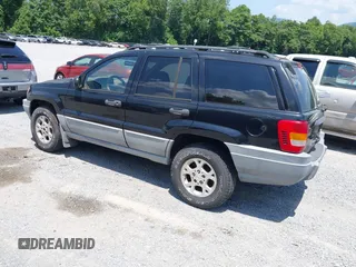 2000 Jeep Grand Cherokee Laredo with VIN 1J4GW48N7YC357376, listed as a IAAI auction lot 42503429 with 211,154 mi miles and . Bid and sale history available at DreamBid. Image 3.