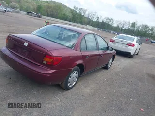 2001 Saturn SL z VIN 1G8ZH52841Z331770, wystawiony jako IAAI lot #42136194 z przebiegiem 70 798 mil mil oraz . Historia ofert i sprzedaży dostępna na DreamBid. Obrazek 4.