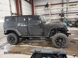 2015 Jeep Wrangler Unlimited Sahara with VIN 1C4BJWEG6FL688382, listed as a IAAI auction lot 41620621 with 138,119 mi miles. Bid and sale history available at carsss.com. Image 14.