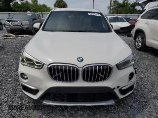 2017 BMW X1 xDrive28i with VIN WBXHT3Z37H4A55614, listed as a Copart auction lot 63491415 with 120,680 mi miles and Salvage title. Bid and sale history available at DreamBid. Image 5.