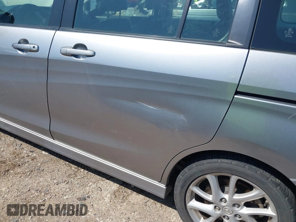2012 Mazda Mazda5 Grand Touring with VIN JM1CW2DL2C0129518, listed as a IAAI auction lot 41872136 with 129,323 mi miles. Bid and sale history available at carsss.com. Image 6.